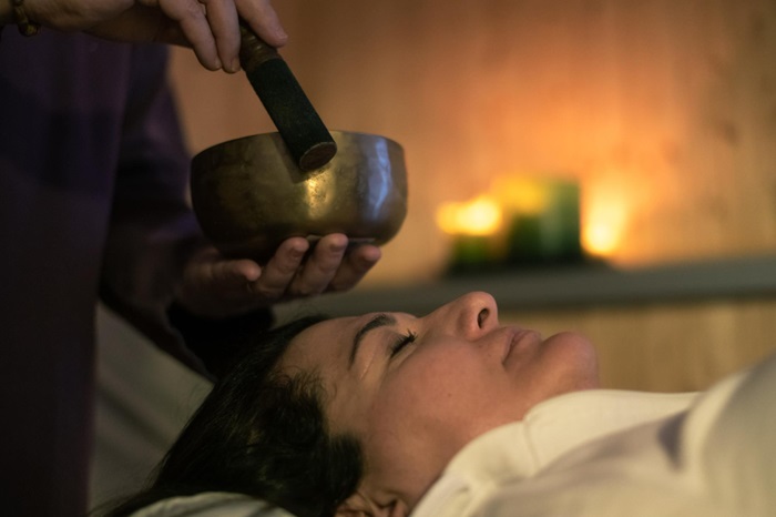 A Woman Enjoys a Relaxing Massage Dduring Ayurveda Retreat Program at Rishikul Yogshala Kerala A Woman Enjoys a Relaxing Massage Dduring Ayurveda Retreat Program at Rishikul Yogshala Kerala