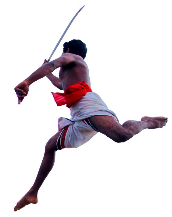 Kalaripayattu warrior performing a dynamic aerial attack with a sword