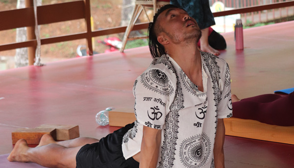 500 Hour Yoga Teacher Training Student Performing Yoga Pose in Nepal at Rishikul Yogshala