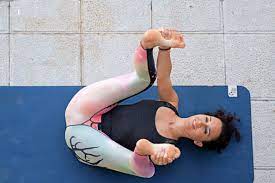 5-yoga-poses-to-reduce-fatigue-happy-baby-pose