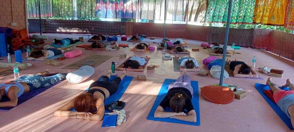 Student Practice Reverse Corpse Yoga Pose During Yoga Teacher Training in India
