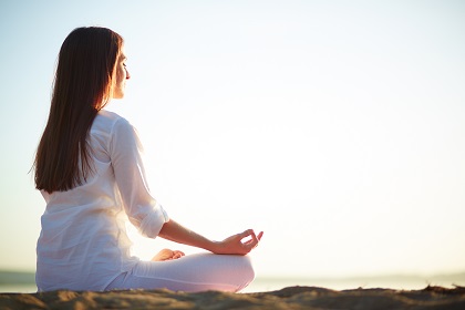 A woman focusing on mindfulness during meditation