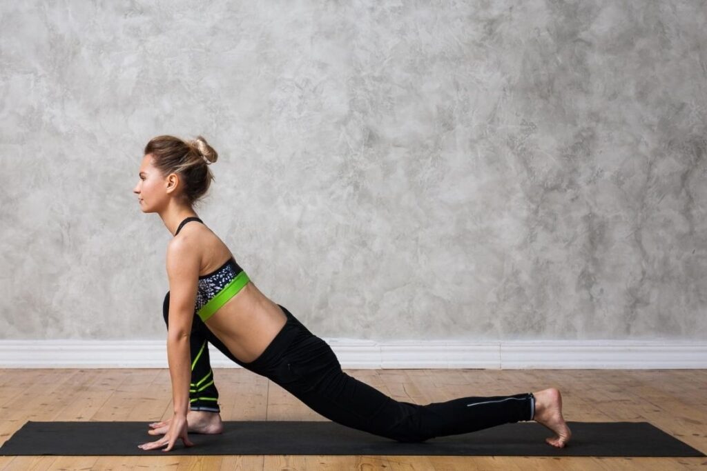 Student Performing Ashwa Sanchalanasana