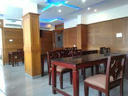 Spacious and Well-Designed Dining Area with Wooden Interiors