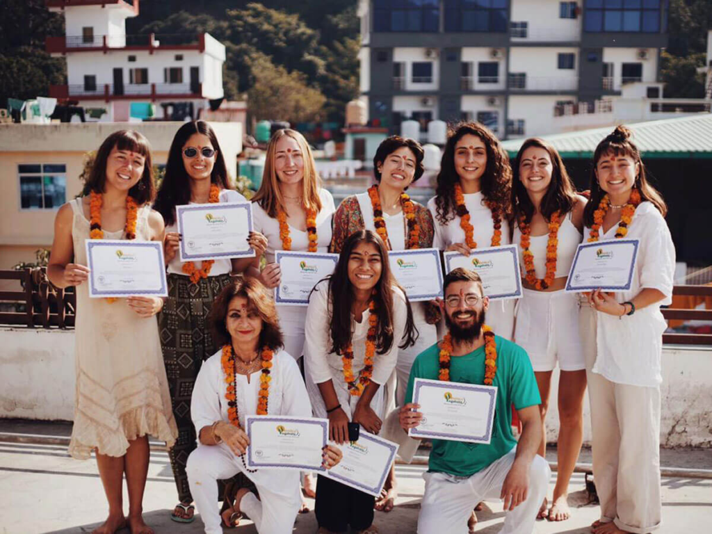 Happy Yoga Graduates with Certificates After Completing Yoga Teacher Training in India Happy Yoga Graduates with Certificates After Completing Yoga Teacher Training in India