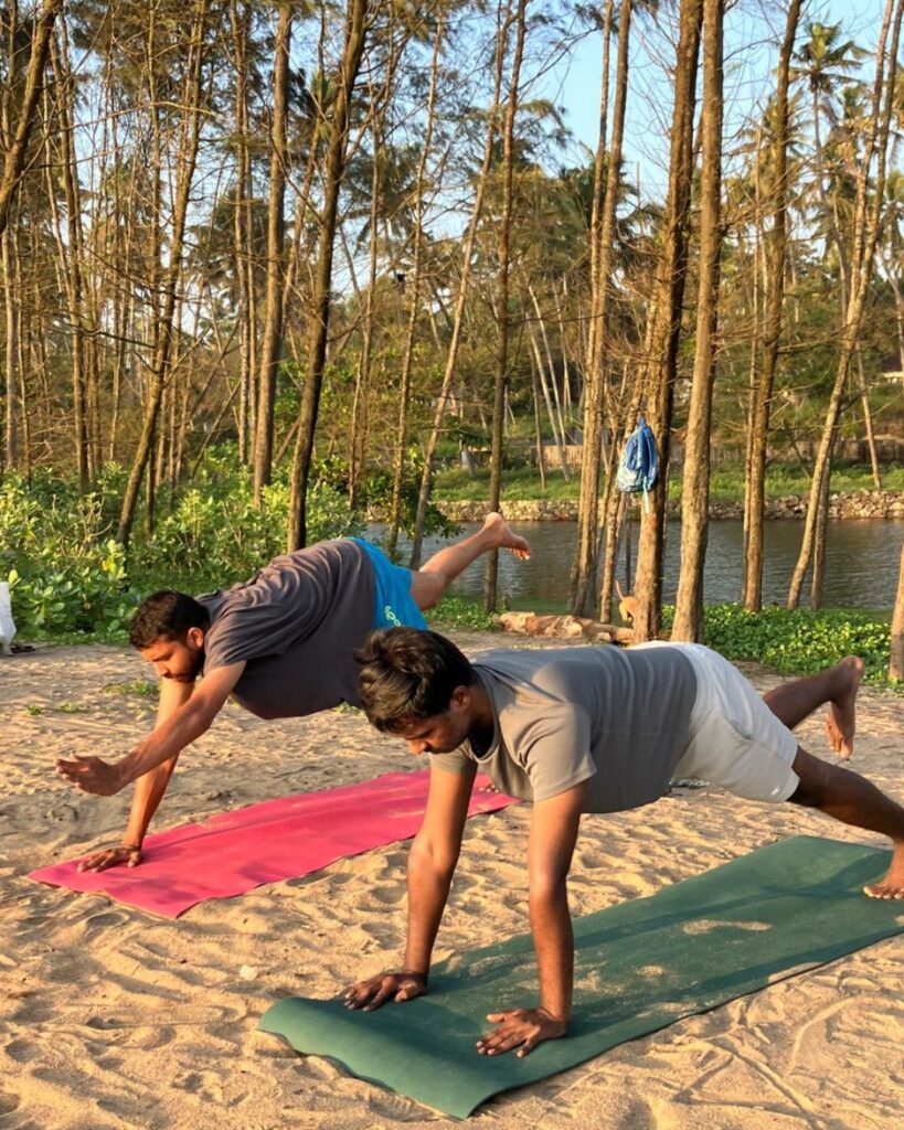 Student practicing yoga poses during YTTC