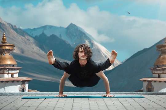Man practicing yoga in a calm setting