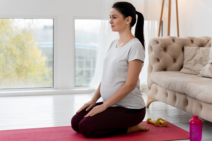 Women Practicing Prenatal Yoga 
