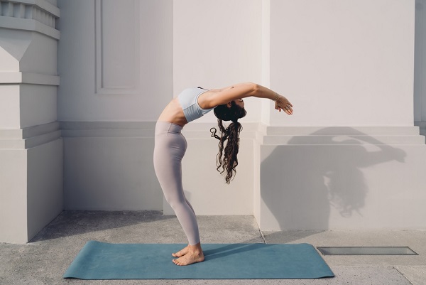 Women Performing Hasta Uttanasana also known as Raised Arm Backbend Pose Women Performing Hasta Uttanasana also known as Raised Arm Backbend Pose