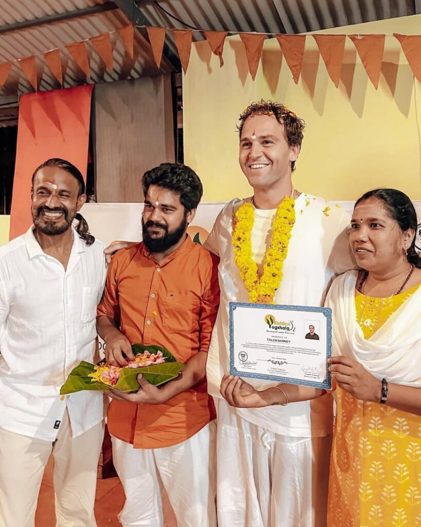 Student showing his 200 hour yttc certificate Student showing his 200 hour yttc certificate