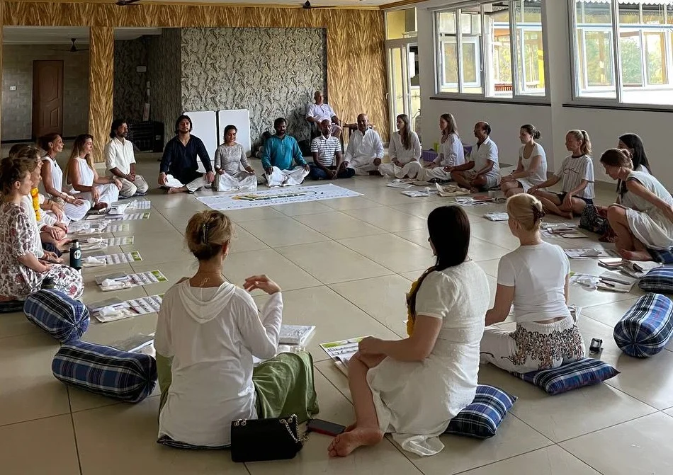 Yoga students sitting in a circle for Yoga Teacher Training in Mysore at Rishikul Yogshala